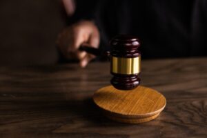 judge hitting wooden base by a gavel