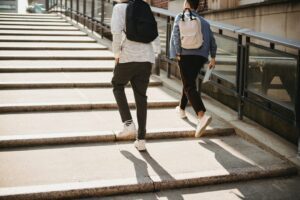 two men walking up the stairs