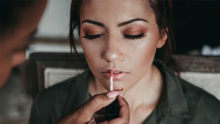 woman applying makeup