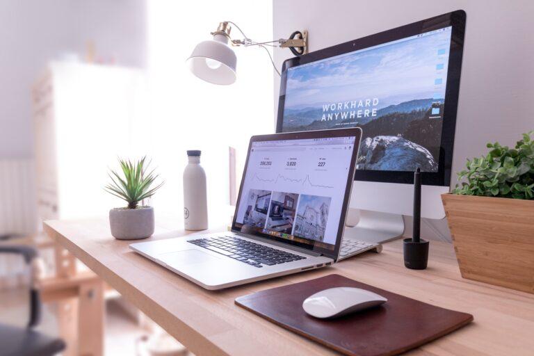 computer and laptop on table