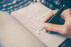 a person writing in notebook