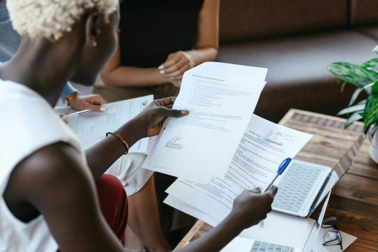 a woman is reading a document