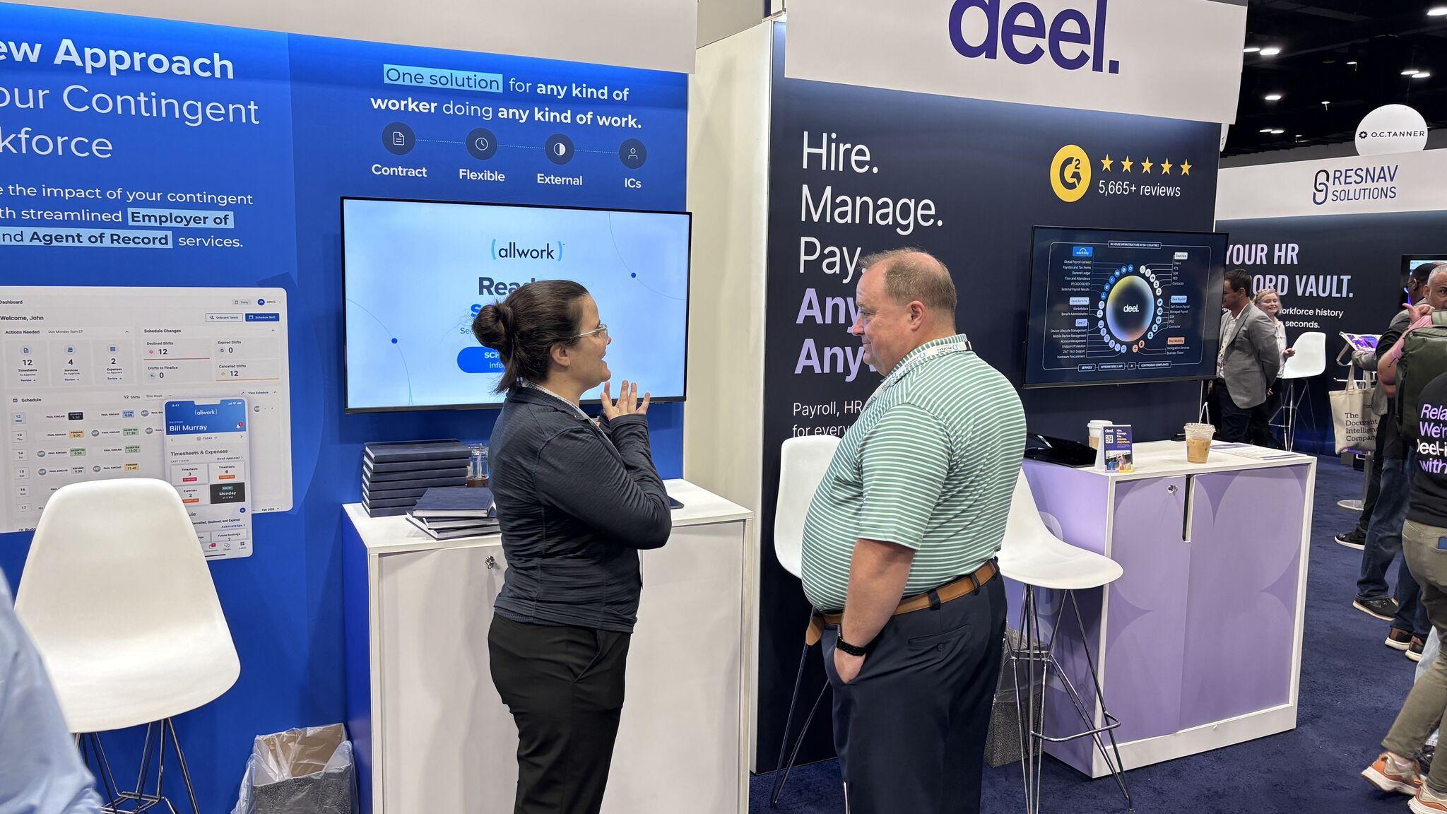 AllWork team member talking with an attendee at the Gartner HR Symposium/Xpo booth